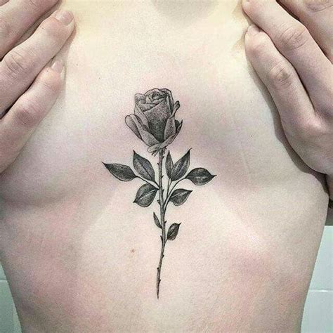 Top 10 rose between breast tattoo ideas and inspiration